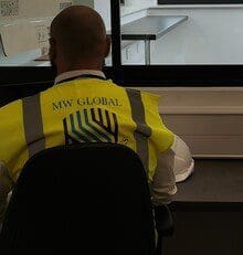 Gatehouse and reception security Guard service, security guard monitoring CCTV inside a gatehouse
