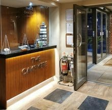 Hotel reception area SIA guard fulfilling night porter duties.