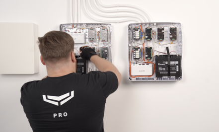 Ajax alarm installation MW Global Security alarm technician installing alarm system.