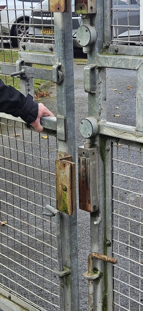 Security audit inspection showing gate access control weakness