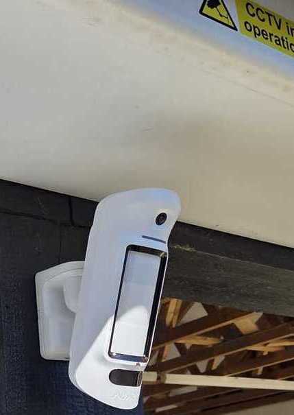 Ajax MotionProtect detector installed at high level on a property in Cambridge