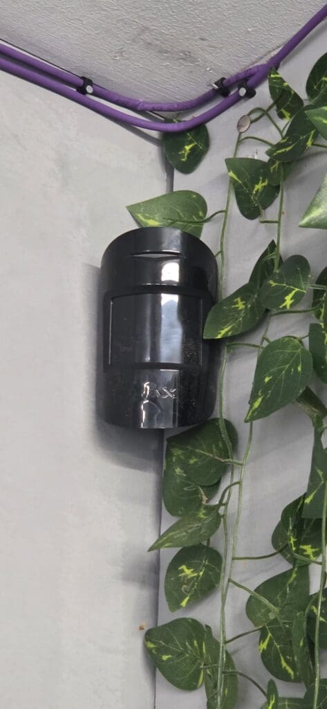 Ajax indoor motion detector installed inside a protected building