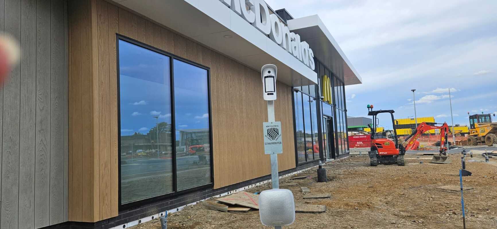 Temporary alarm system with camera PIR on a tripod protecting plant at a Lowestoft construction site