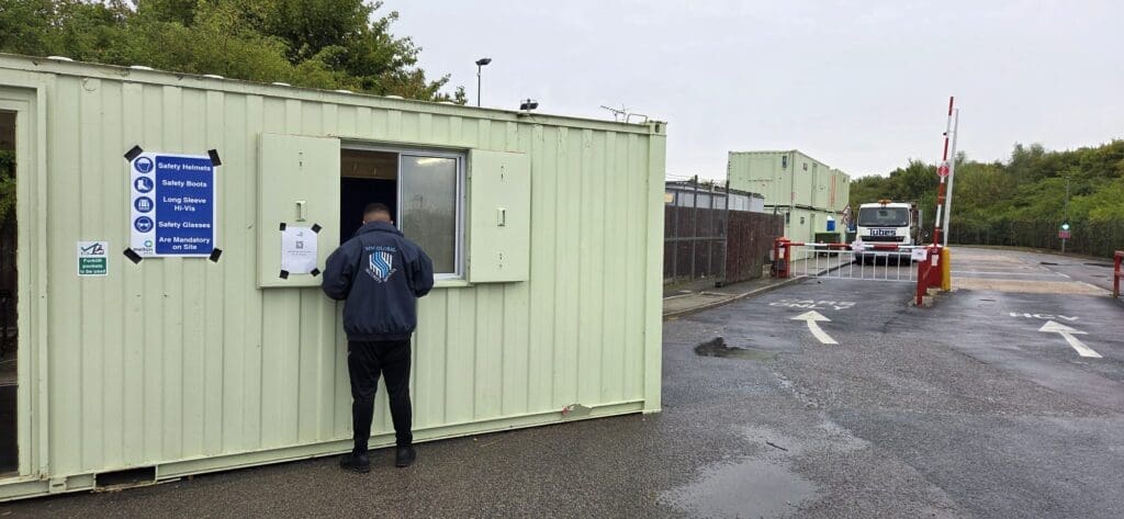 MW Global security officer working at an industrial site entrance and gatehouse in Sutton, Ely, Cambridgeshire.