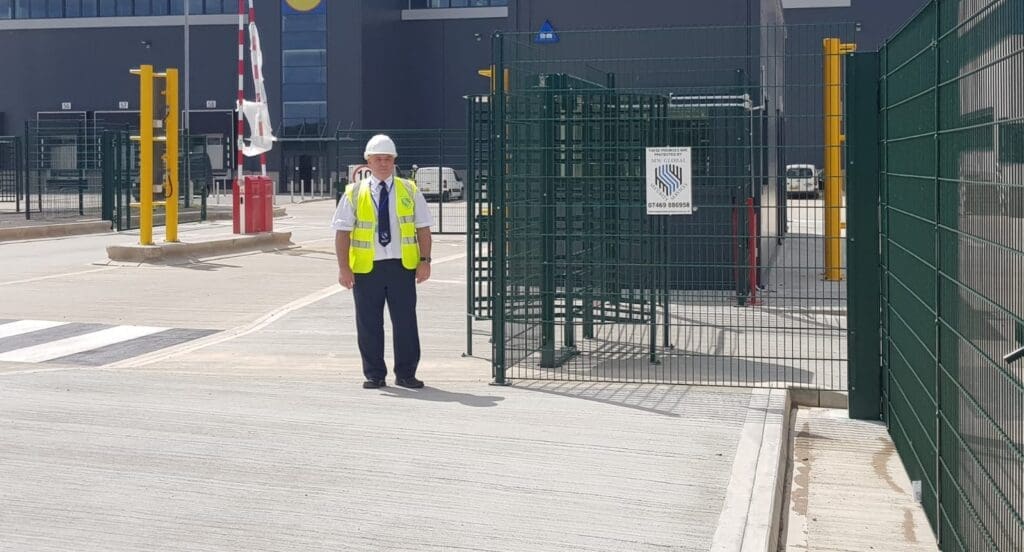 Security guard carrying out site-access control duties at a commercial location